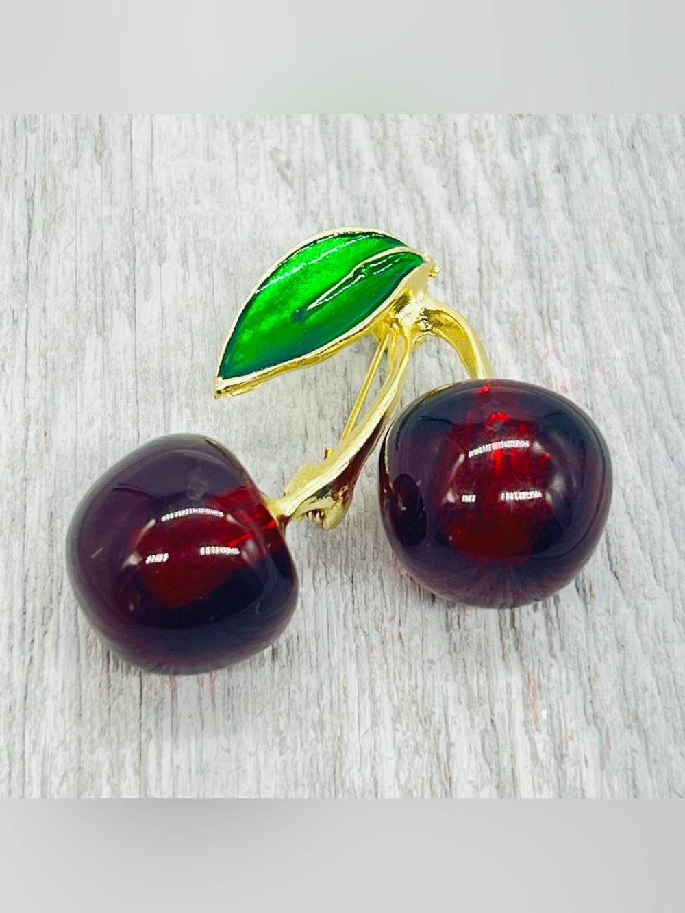 365. Gold-Tone Cherry Brooch with Red Lucite and Green Enamel Leaf